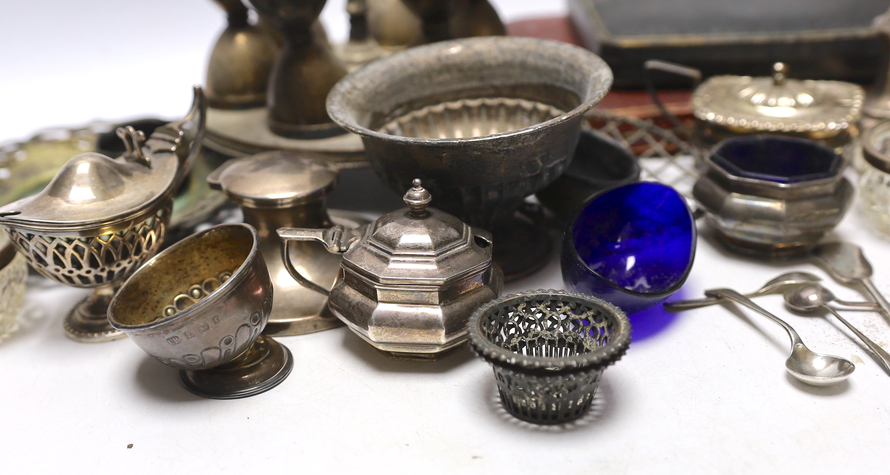 Sundry silver including three piece condiment set, two cased sets of teaspoons, five other condiments, salt spoons, pair of small pierced holders, inkwell and a small rose bowl, together with various plated items.